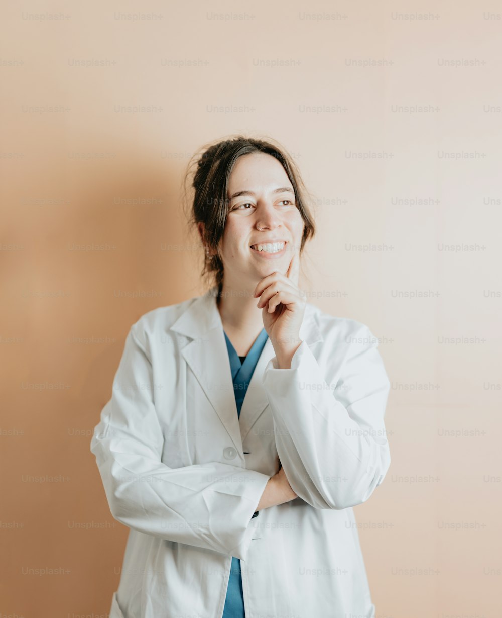 a woman in a lab coat posing for a picture