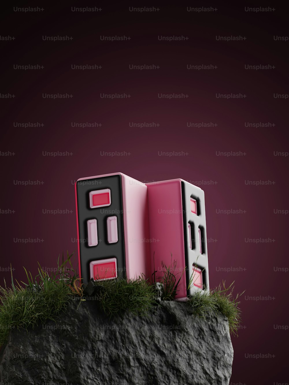 바위 위에 앉아 있는 분홍색 상자