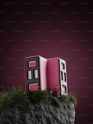 a pink box sitting on top of a rock