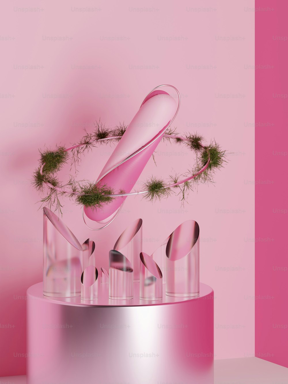 a pink sculpture with a green plant on top of it