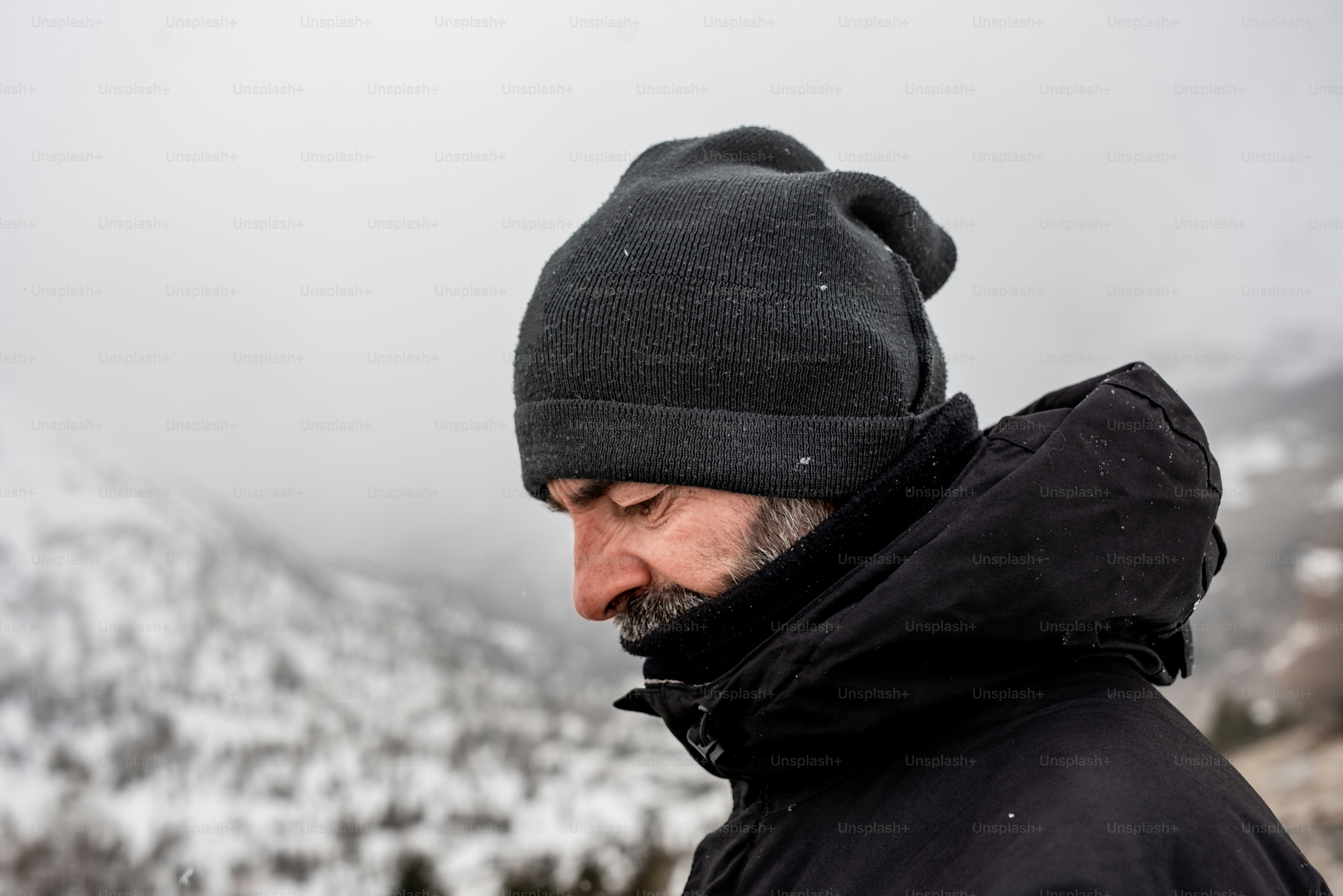 a man with a beard wearing a beanie