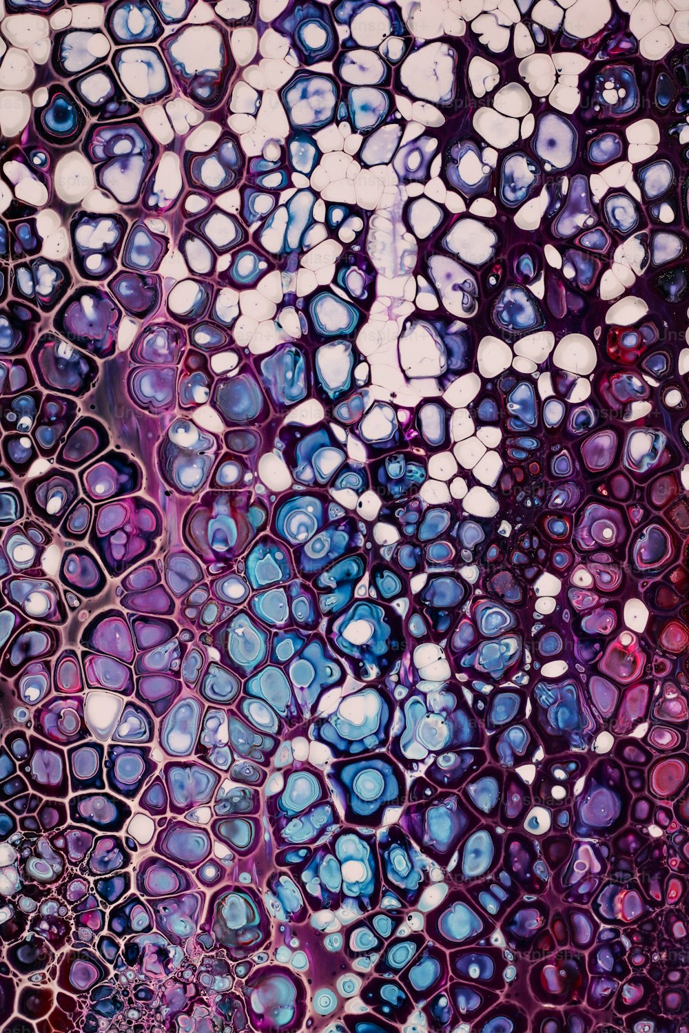 a close up of an abstract painting with blue and purple colors