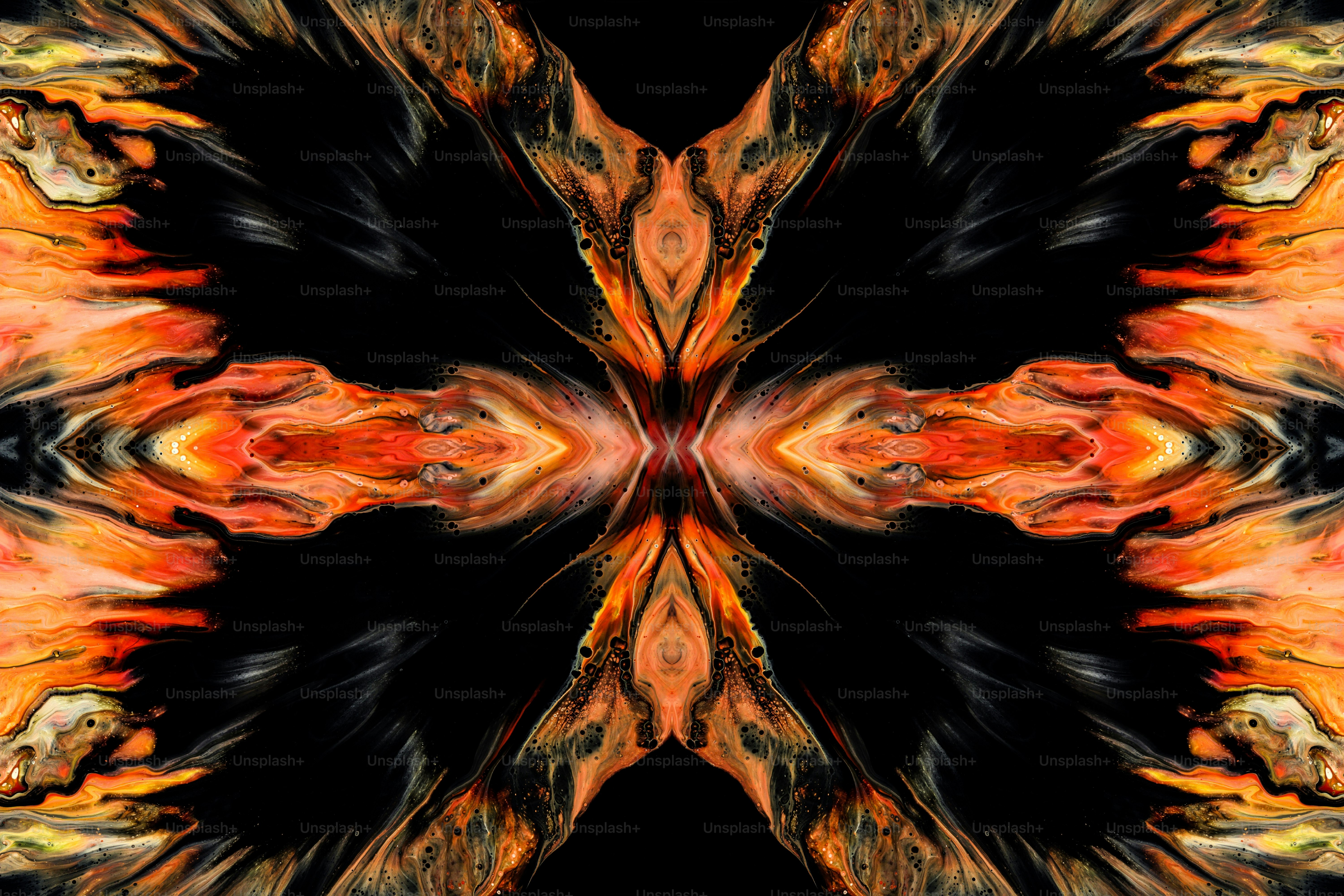 Una imagen abstracta de una flor naranja y negra