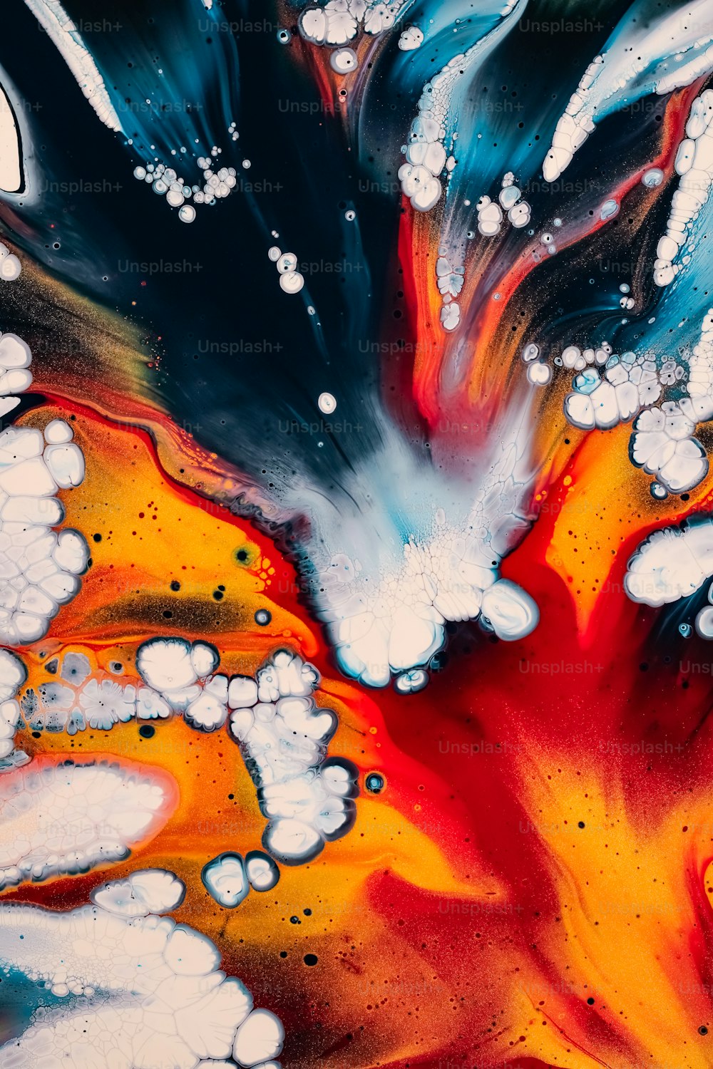 a close up of an abstract painting with white and red colors