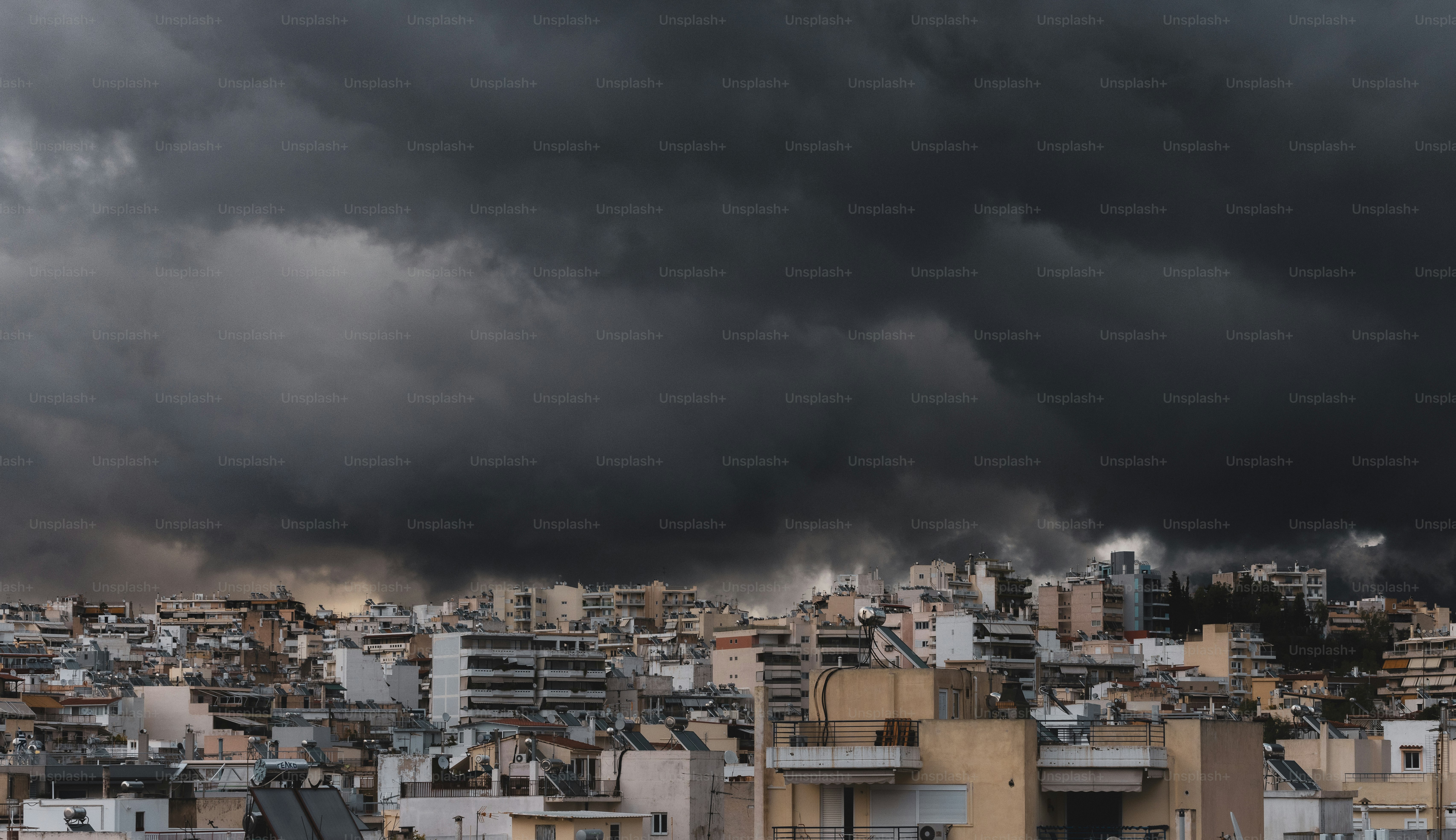 a city with lots of tall buildings under a cloudy sky