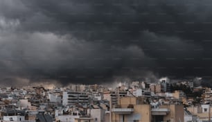 a city with lots of tall buildings under a cloudy sky