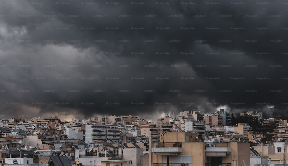 a city with lots of tall buildings under a cloudy sky