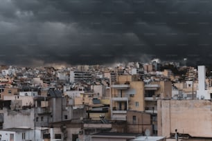 a city with lots of tall buildings under a cloudy sky