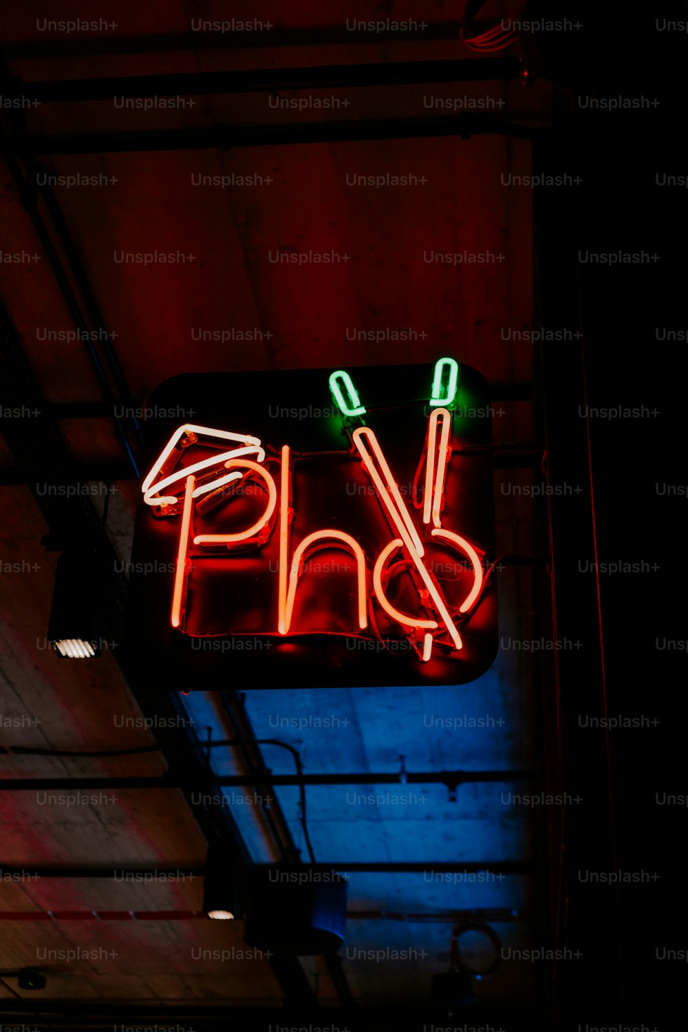 a neon sign that says pho on it