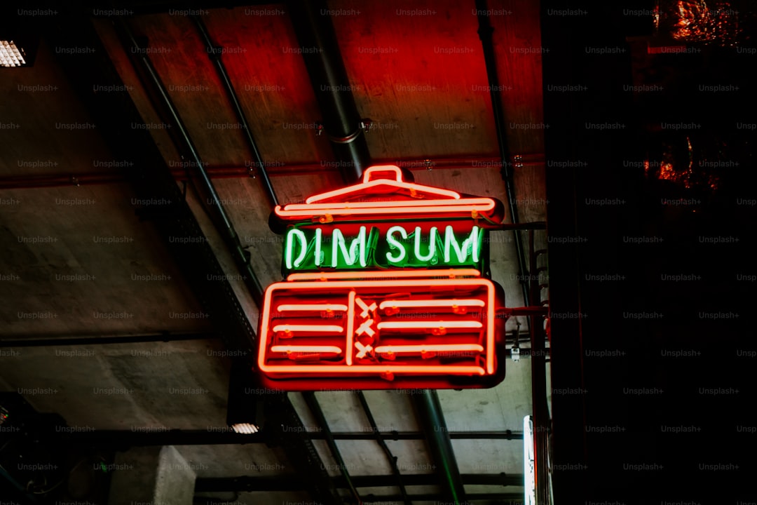 a neon sign hanging from the side of a building