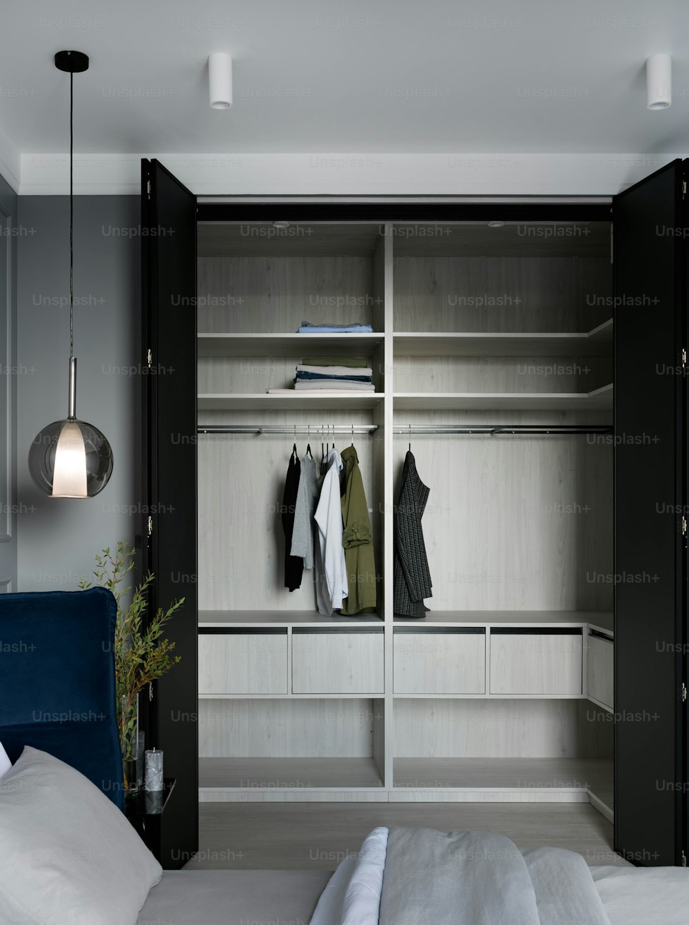 a bedroom with a bed and a closet