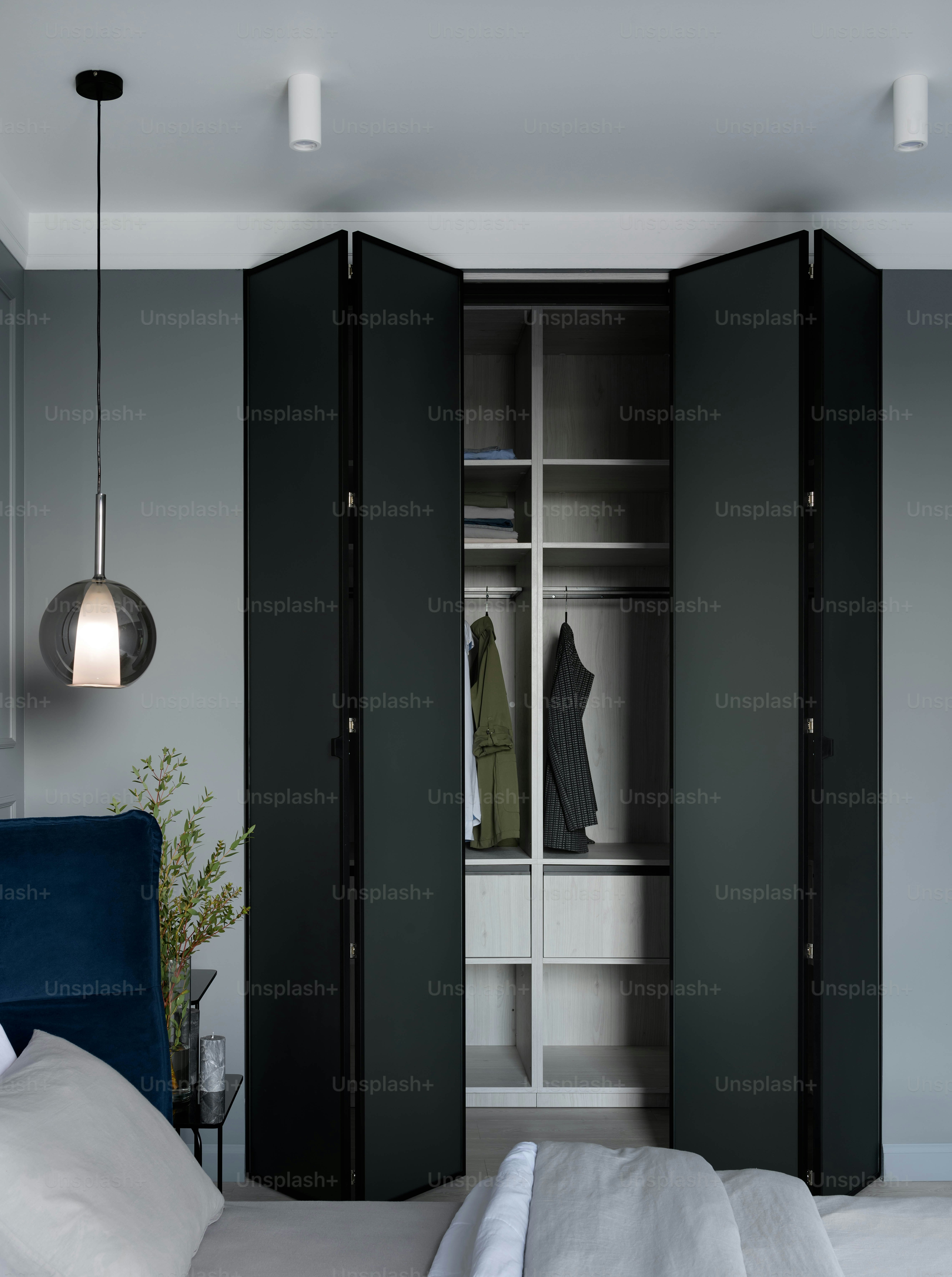 a bedroom with a bed and a closet