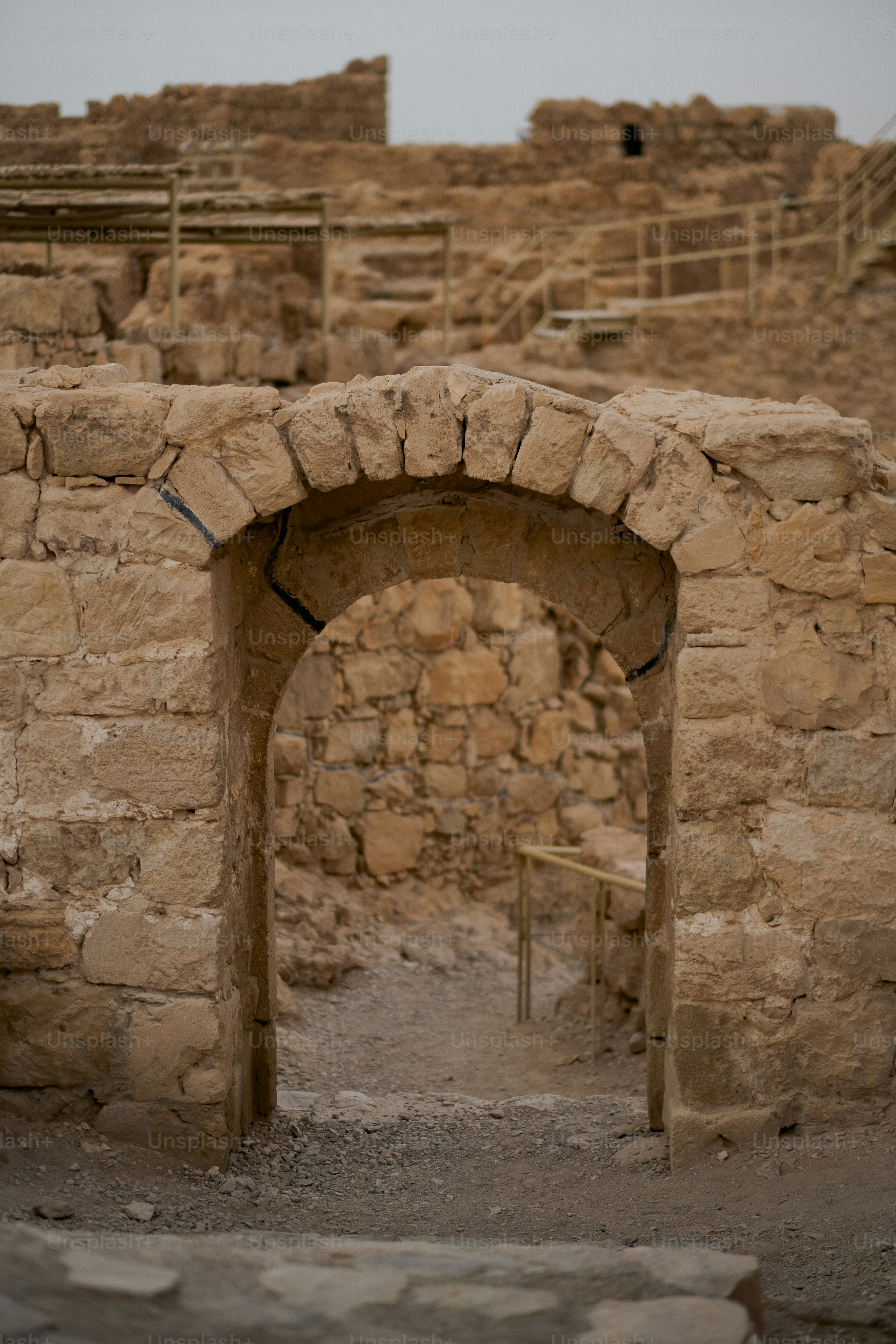 Walking around Masada fortress' ancient ruins and modern reconstructions.