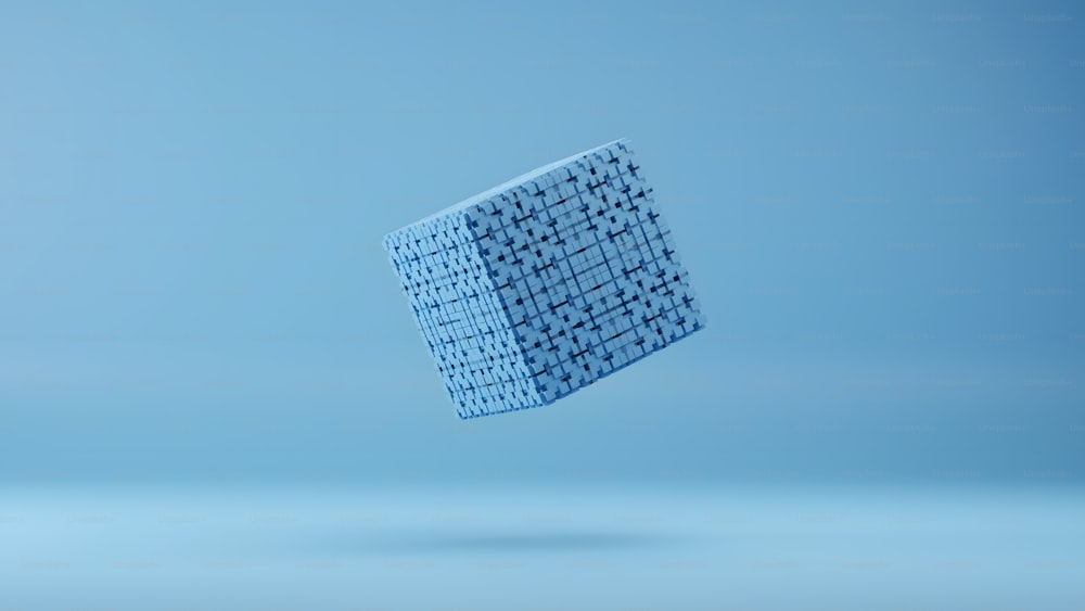 um objeto quadrado azul flutuando no ar
