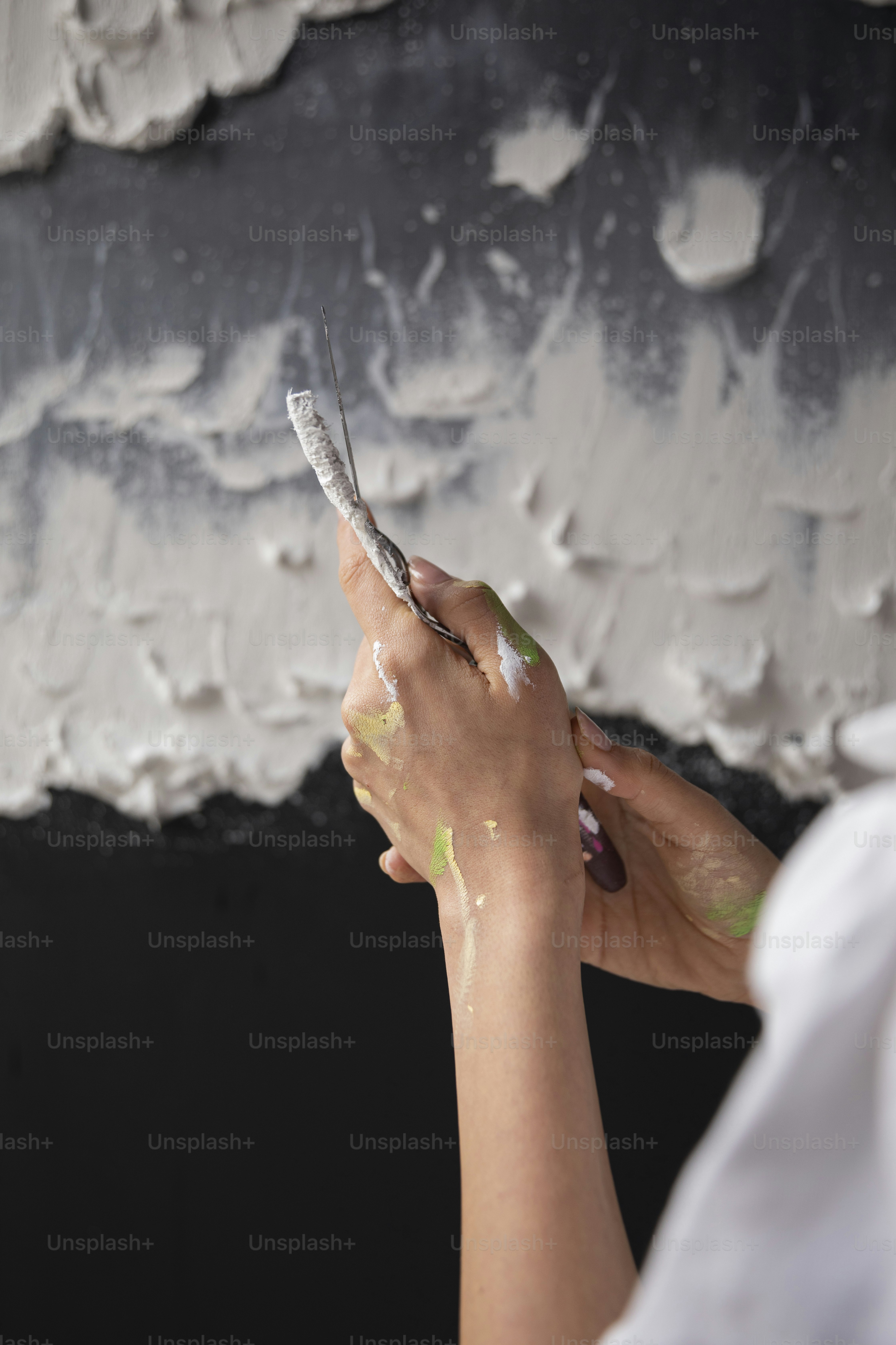 a woman holding a pair of scissors in her hand