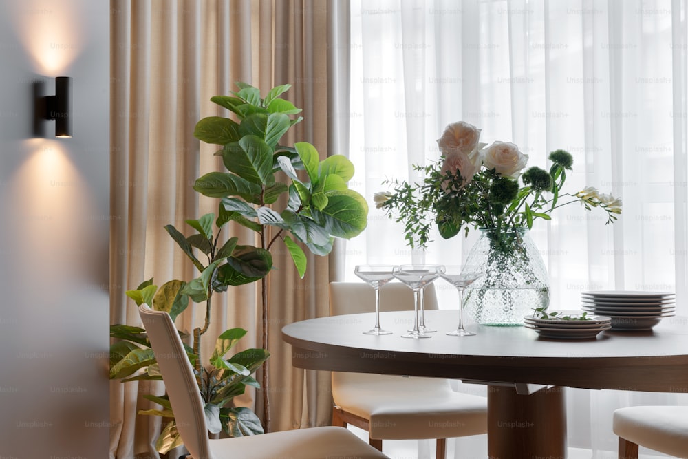 a table with a vase of flowers on top of it