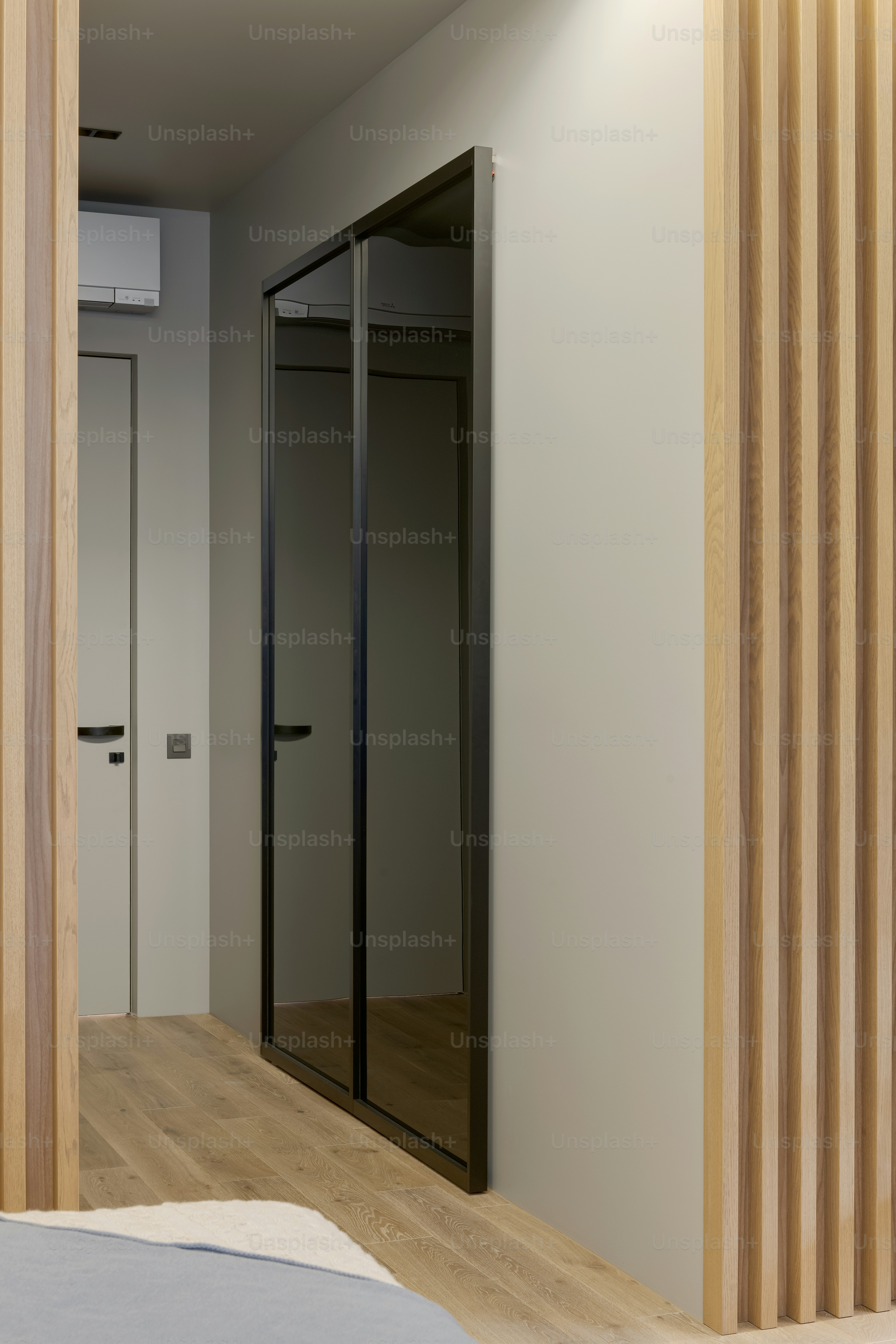 a room with a bed and a sliding glass door