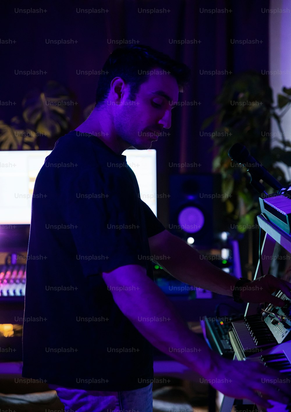 a man standing in front of a keyboard