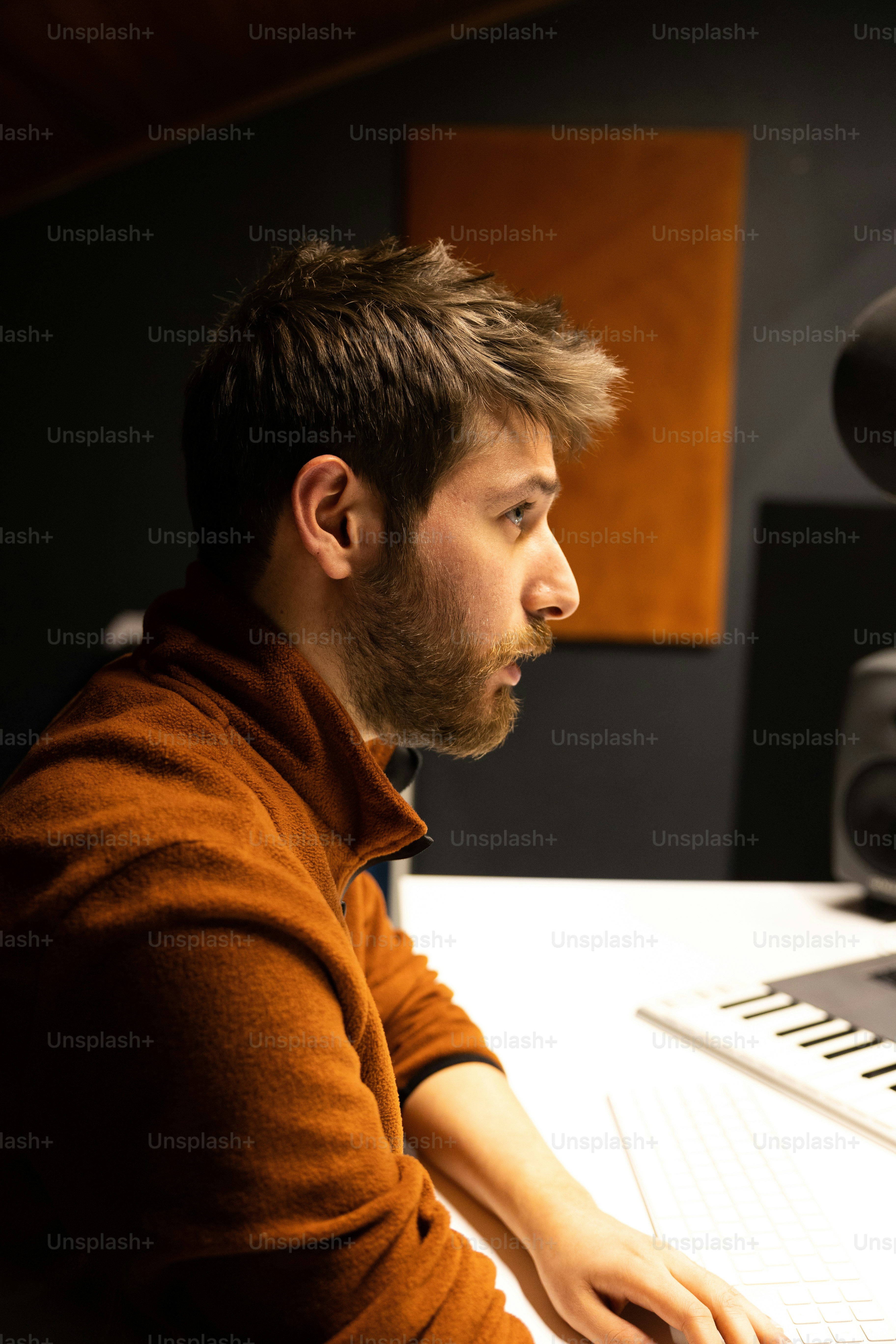 a man sitting in front of a computer keyboard