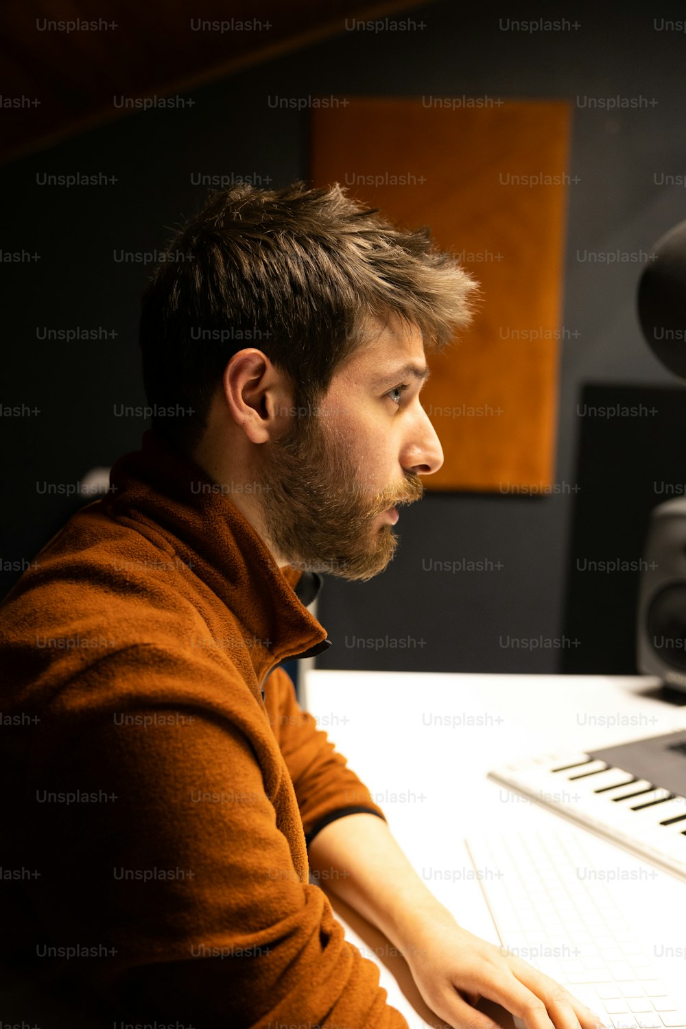 a man sitting in front of a computer keyboard