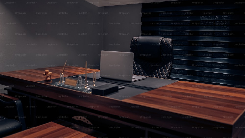 a wooden desk topped with a laptop computer