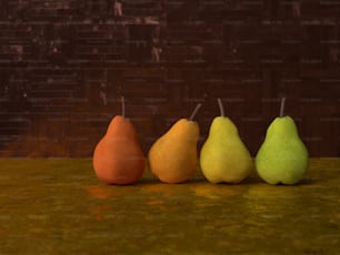 a row of four pears sitting on top of a counter