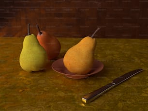 due pere e un piatto con un coltello su un tavolo