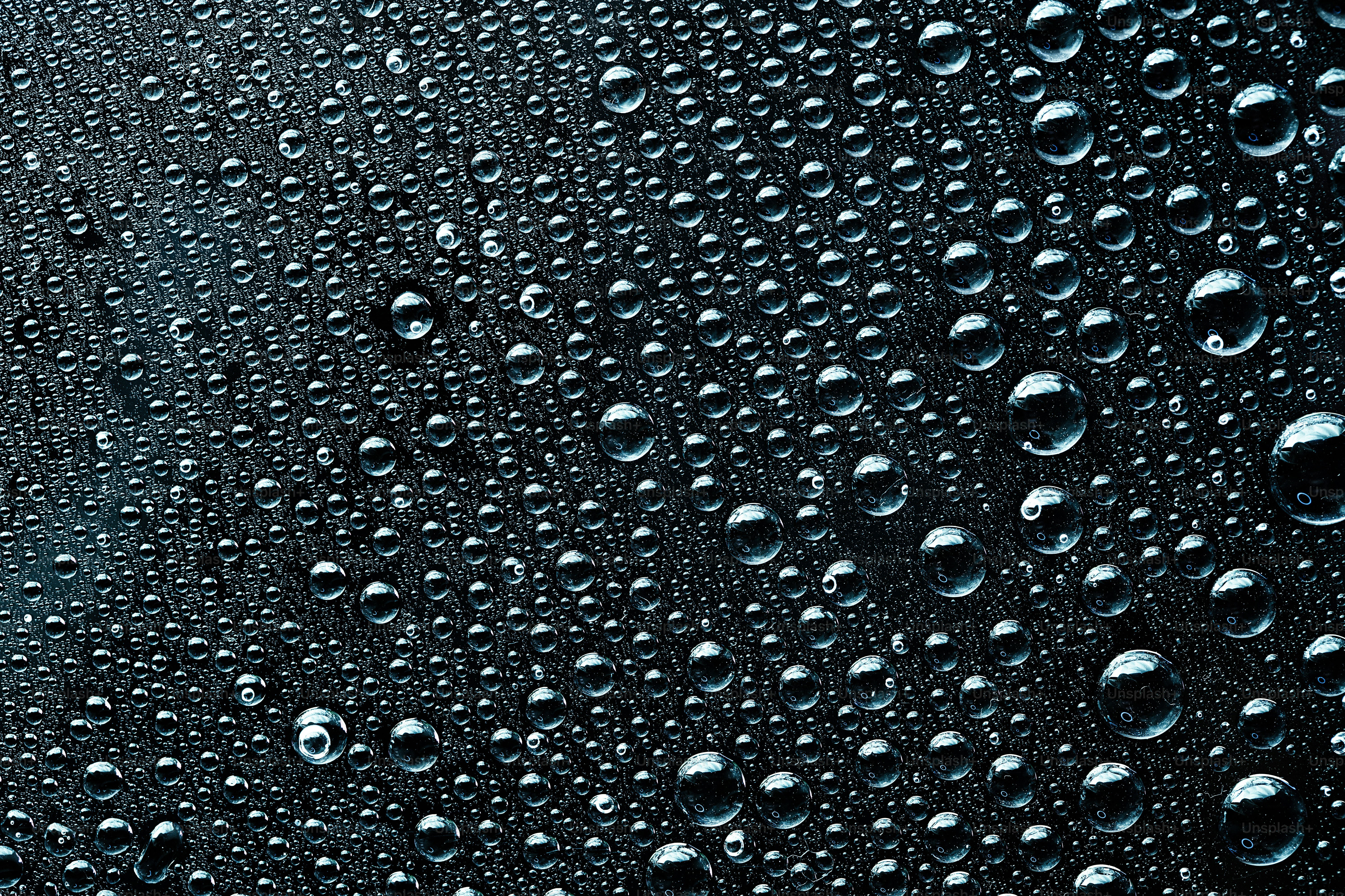 A close up of water droplets on a black surface photo – Wallpaper Image on  Unsplash, image size:3000x2000