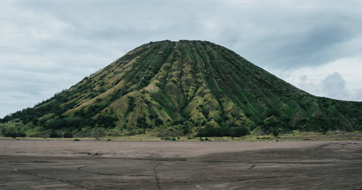 A Very Large Mountain With A Very Tall Hill In The Background Photo a-very-large-mountain-with-a-very-tall-hill-in-the-background-photo