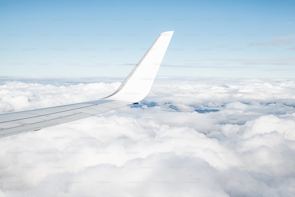 the wing of an airplane above the clouds