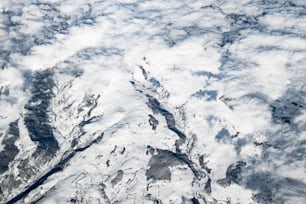 an aerial view of a snow covered mountain