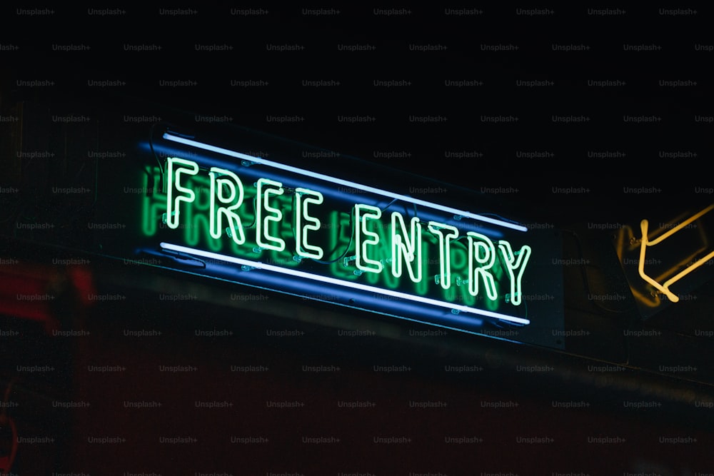 a neon sign that reads free entry