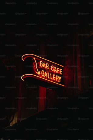 a neon sign that says bar cafe gallery