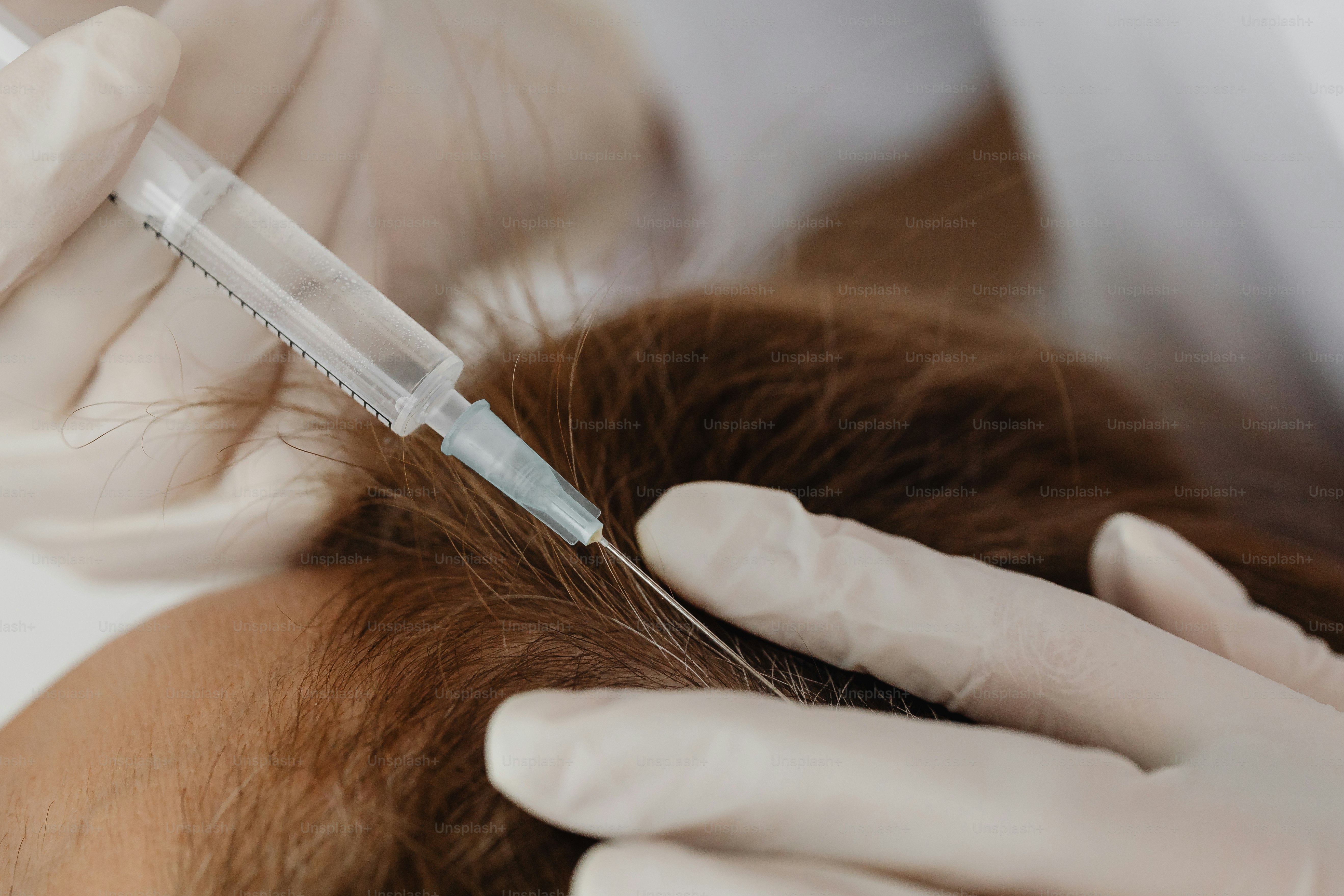 a woman getting her hair cut by a doctor