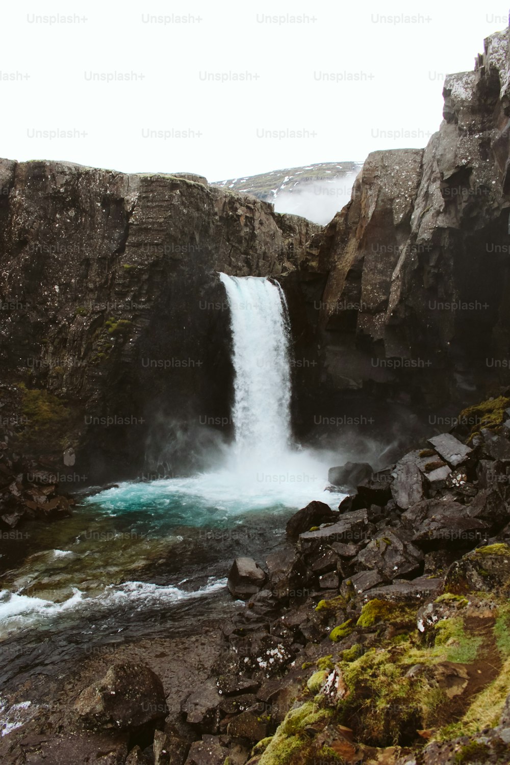 a waterfall with water coming out of it