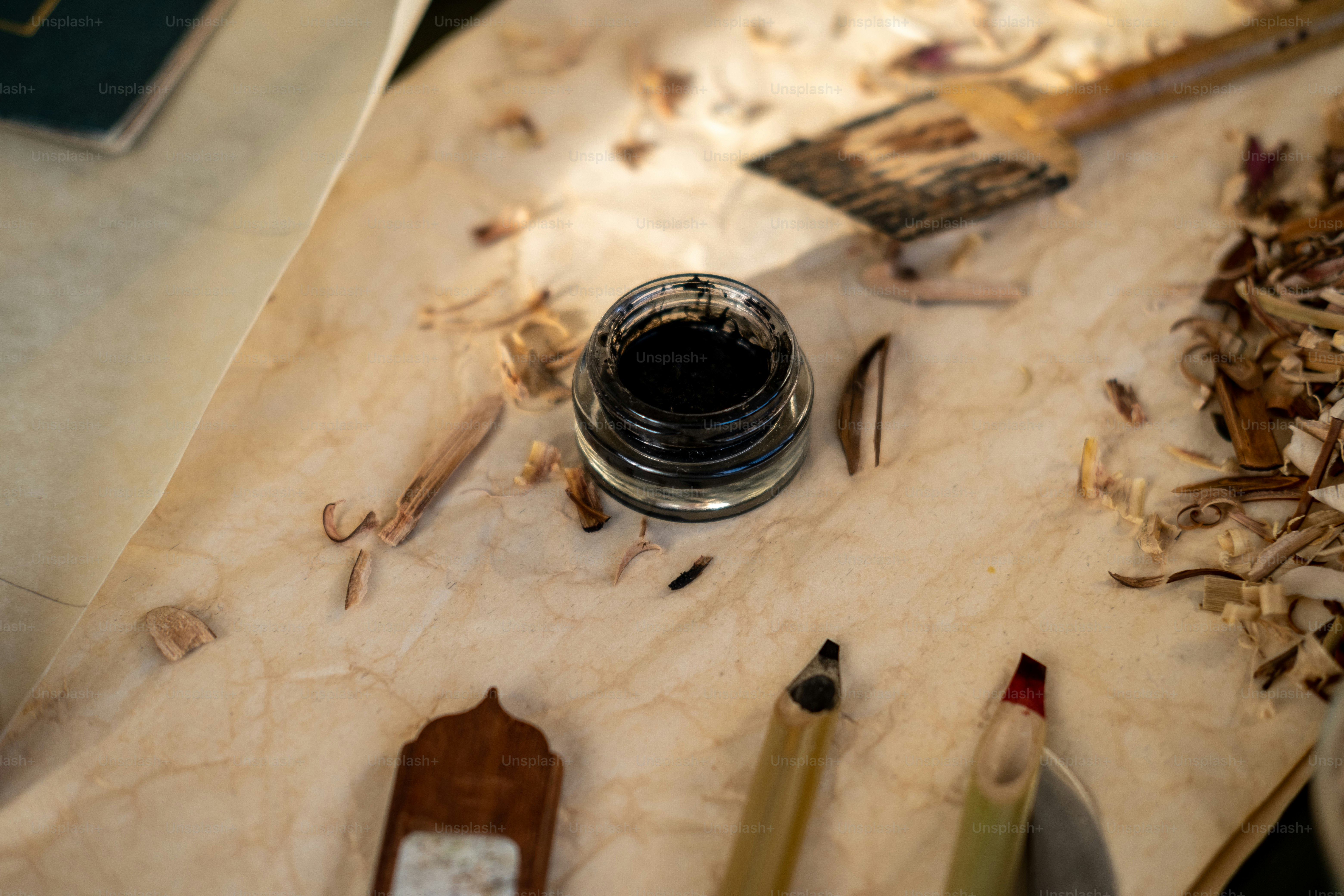a close up of a table with a lot of pencils