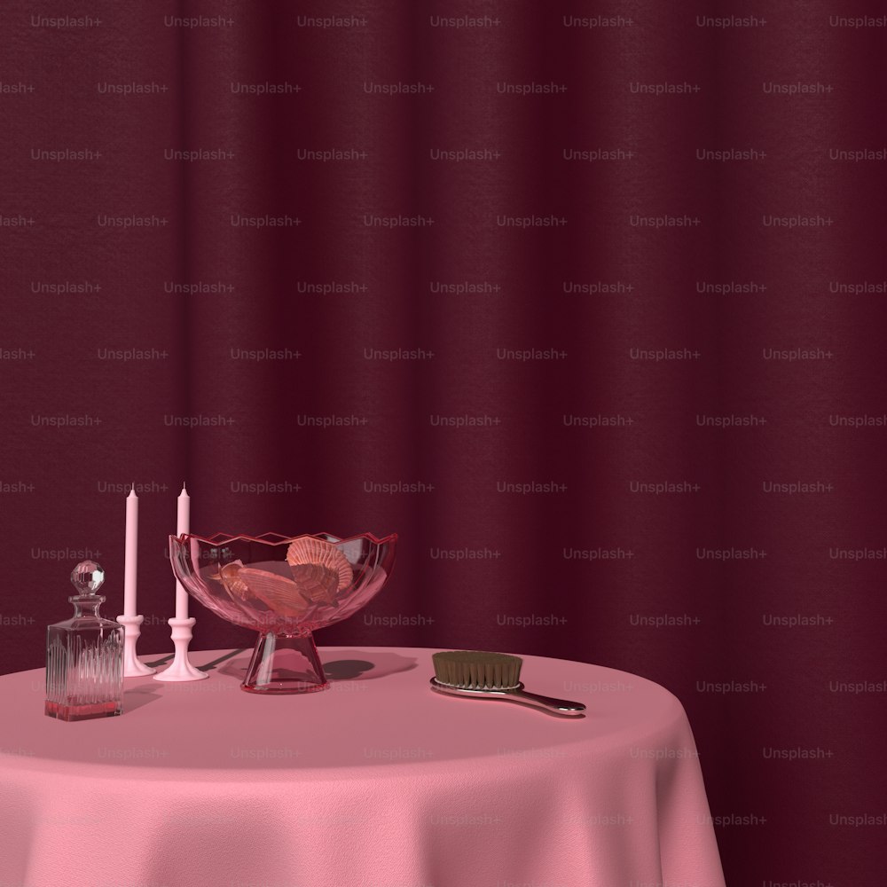una mesa con un mantel rosa y un cuenco de vidrio