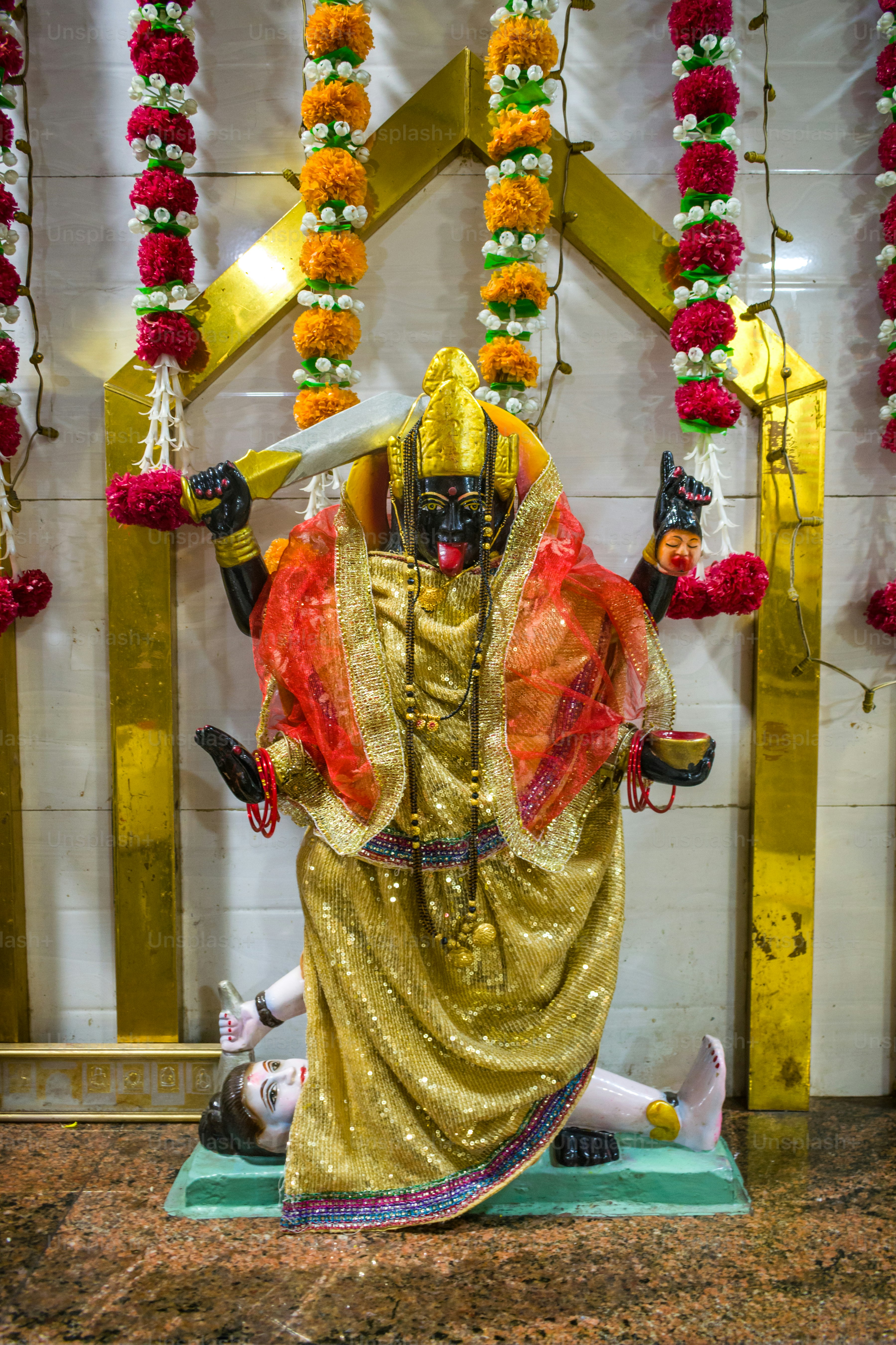 a statue of a man dressed in a golden outfit