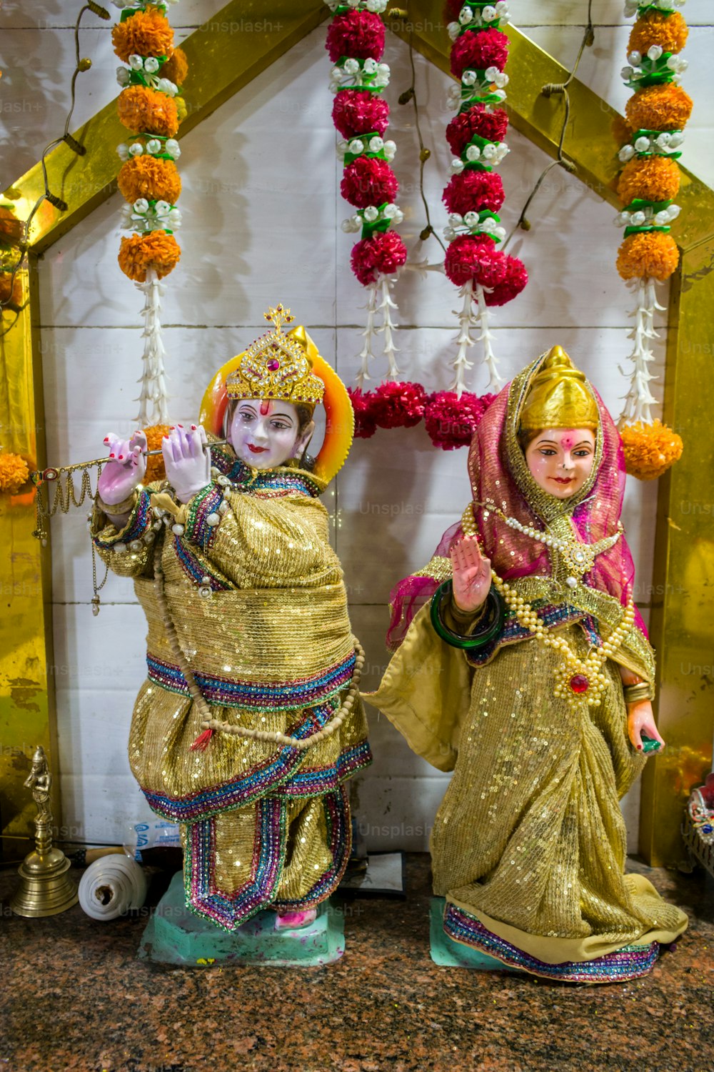 a couple of statues sitting next to each other