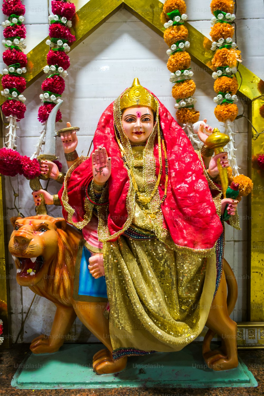 a statue of a woman sitting on top of a lion