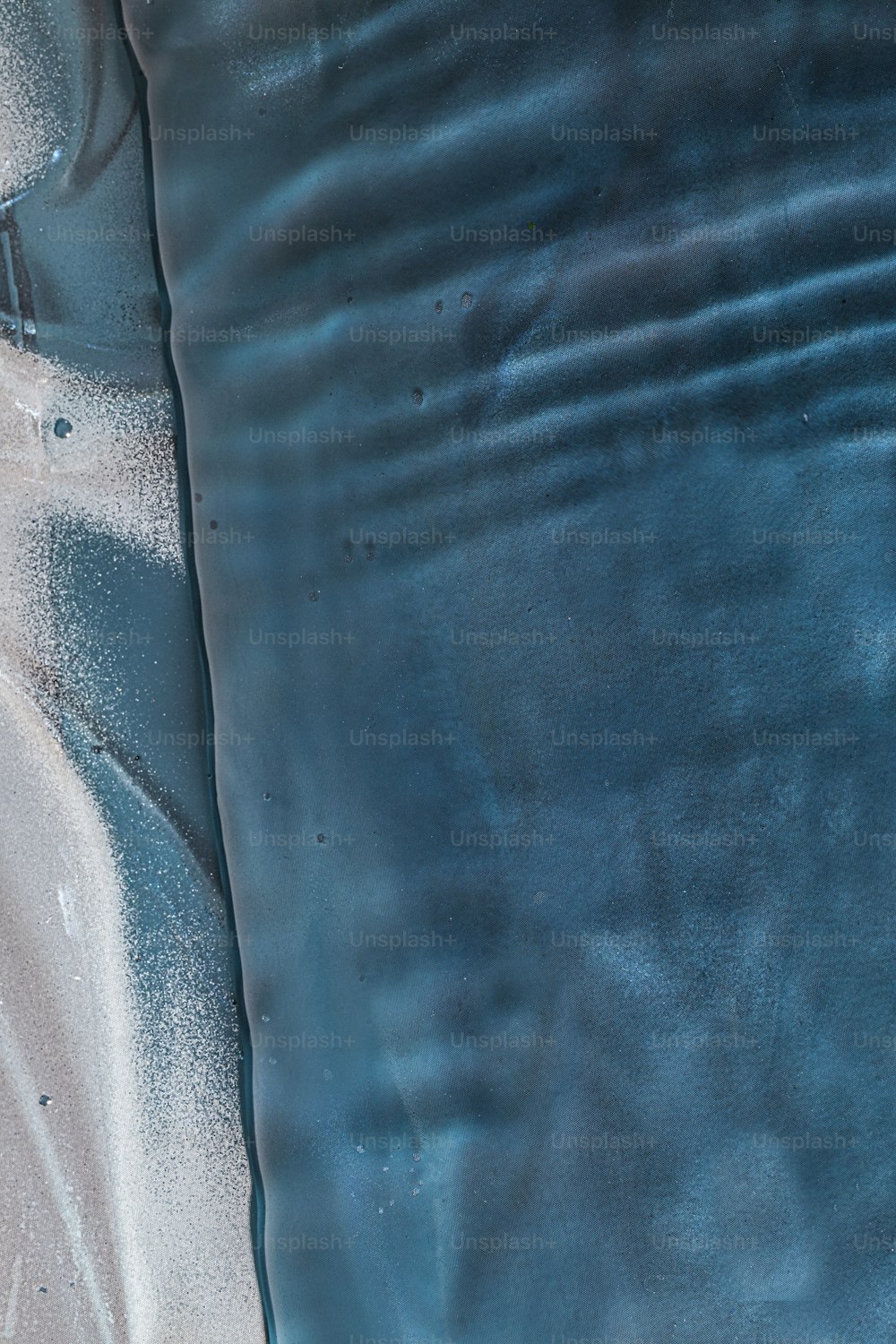 a close up of a blue and white surface