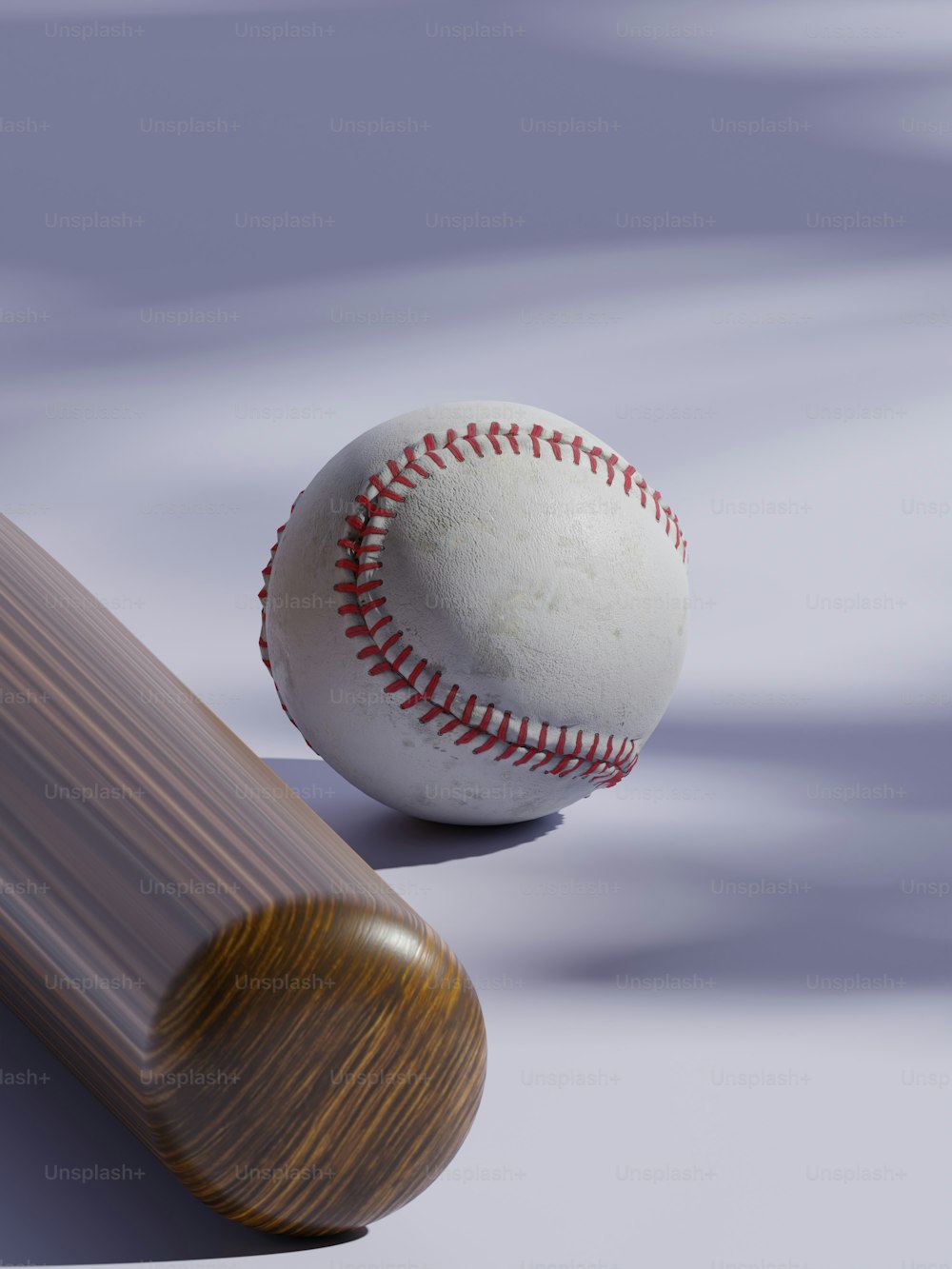 a baseball bat and a baseball on a white surface