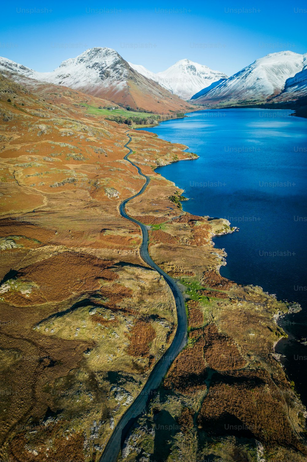 an aerial view of a river and mountains