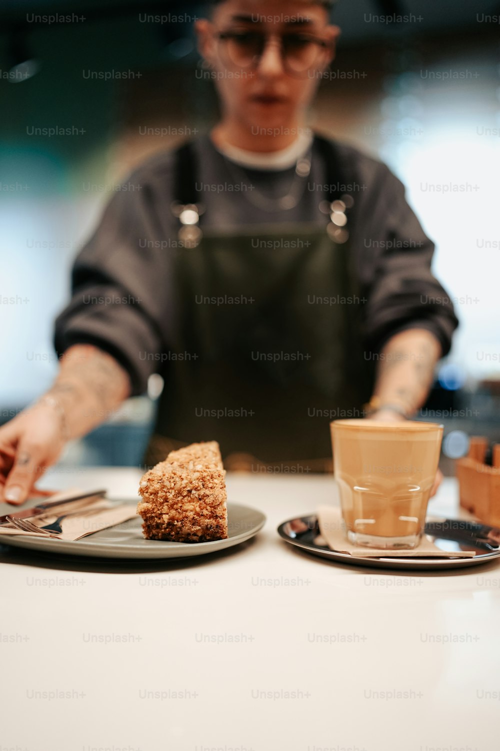 a person sitting at a table with a plate of food