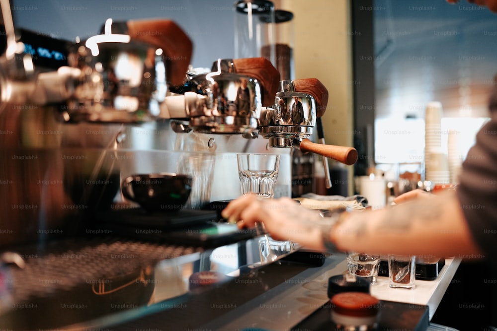 a man is making a cup of coffee