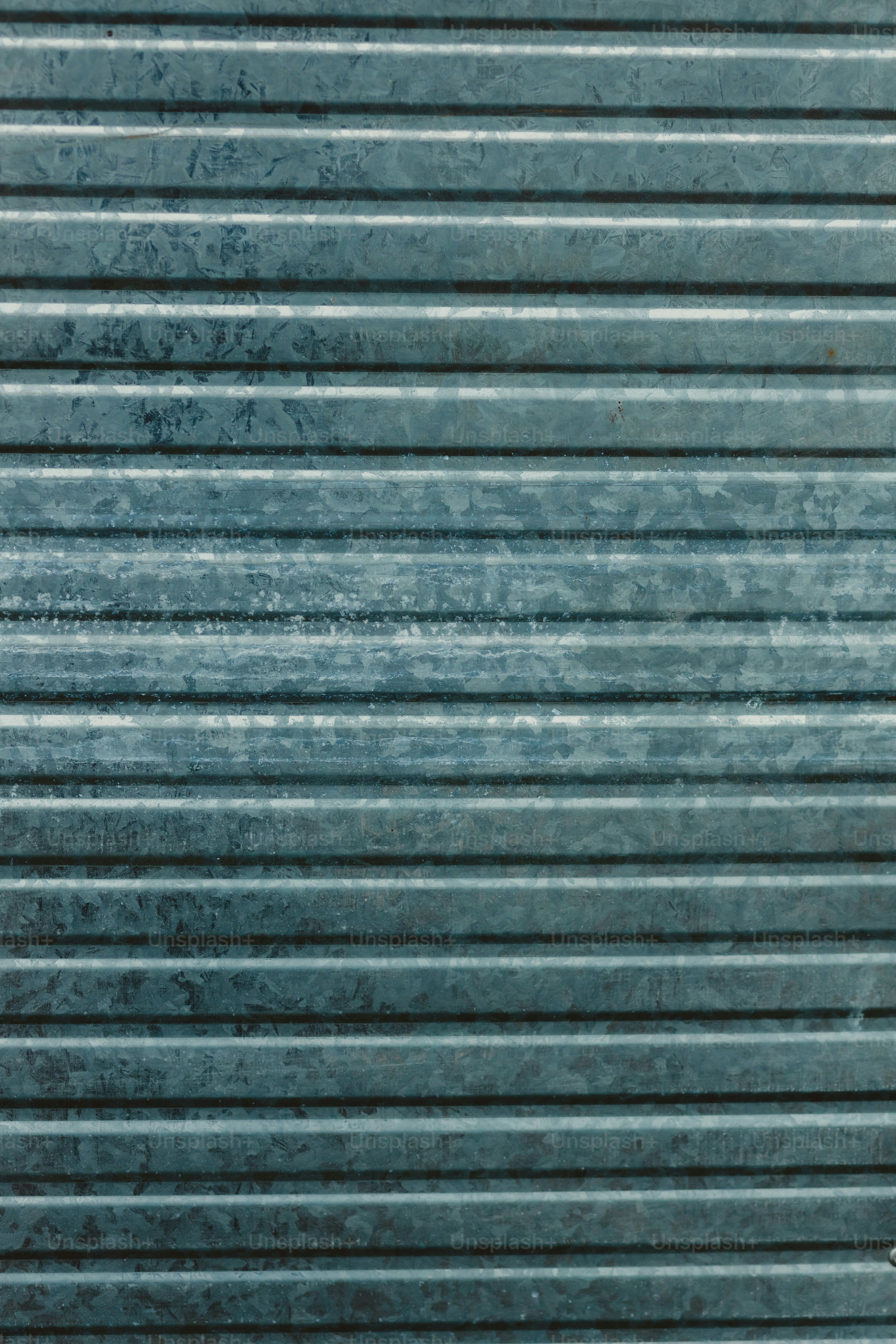 a man with a skateboard standing in front of a garage door