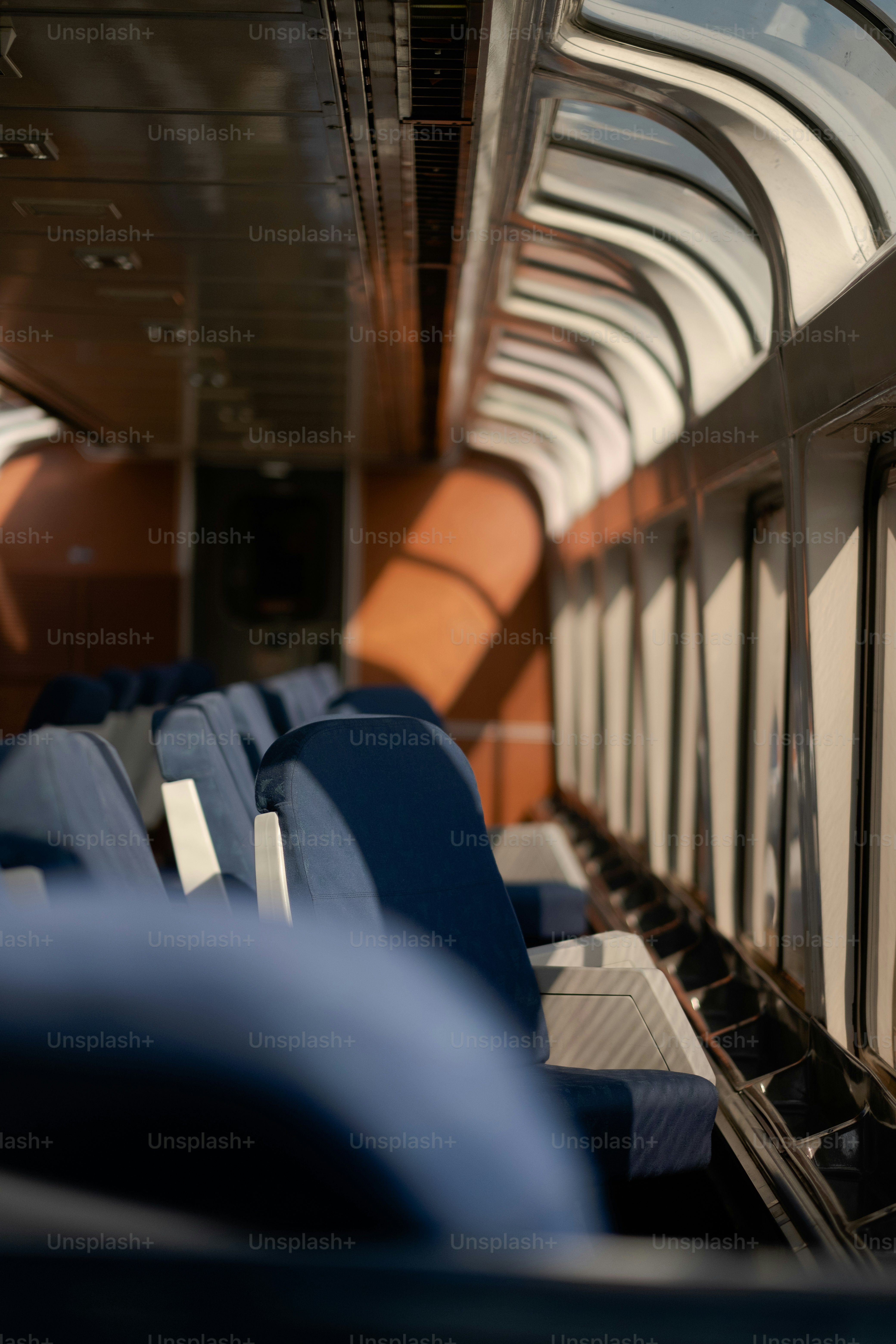the inside of a train with blue seats