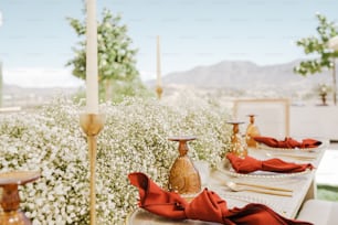 a long table with red napkins on it