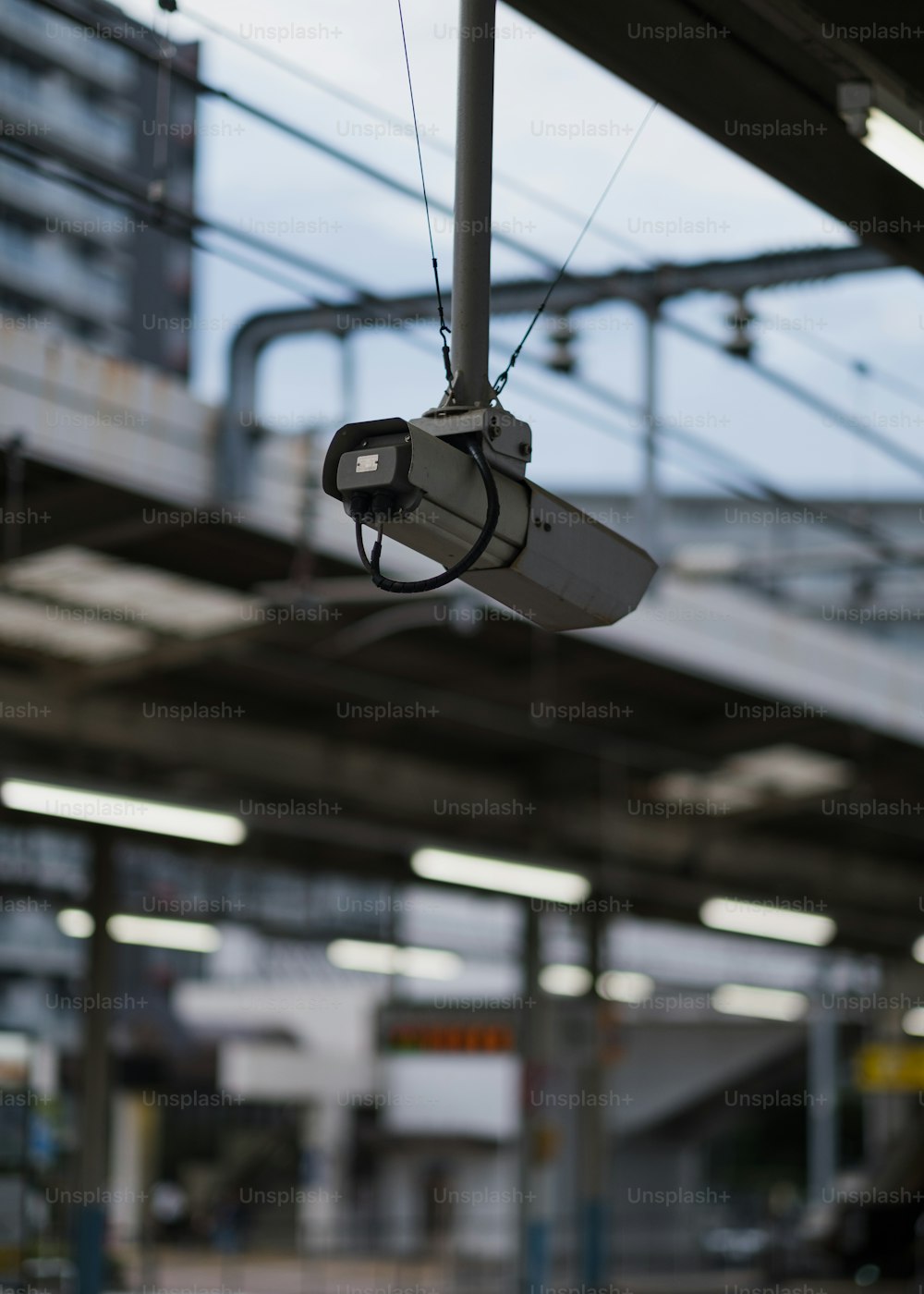a security camera hanging from the ceiling of a building