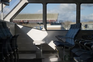 a row of chairs sitting next to each other near a window